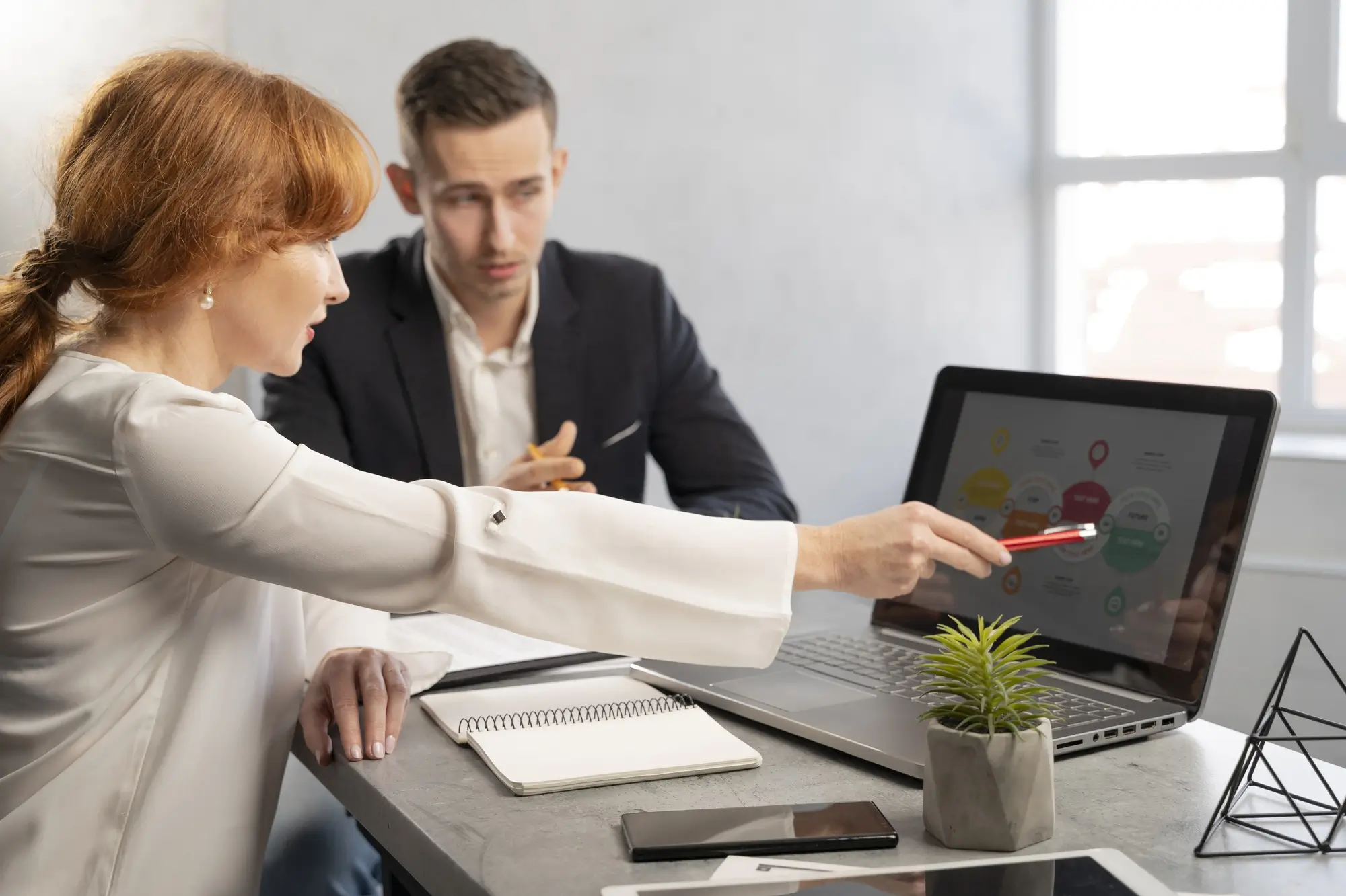 Real estate professional organizing client inquiries and follow-up