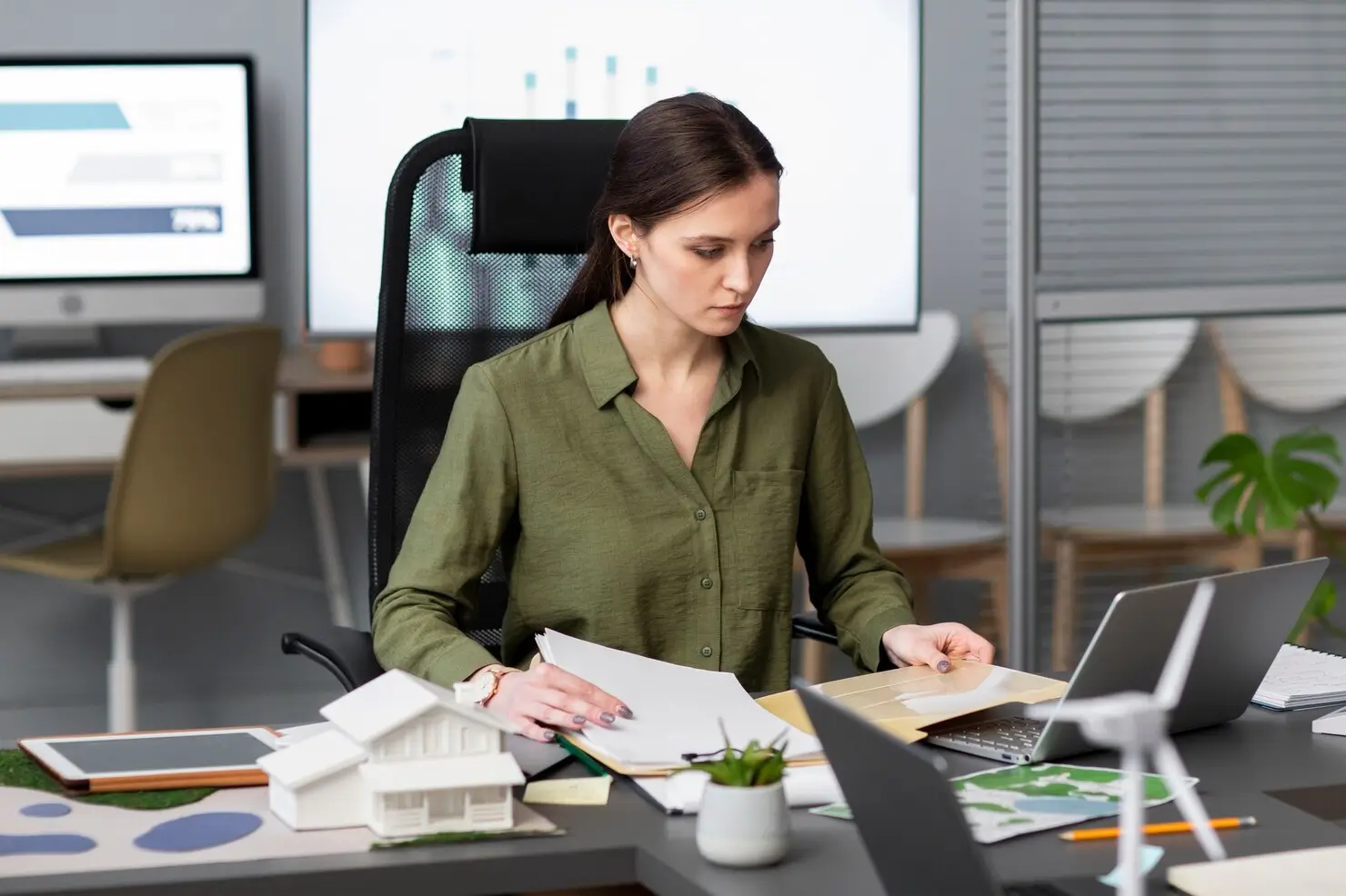 Real estate business owner reviewing a marketing budget